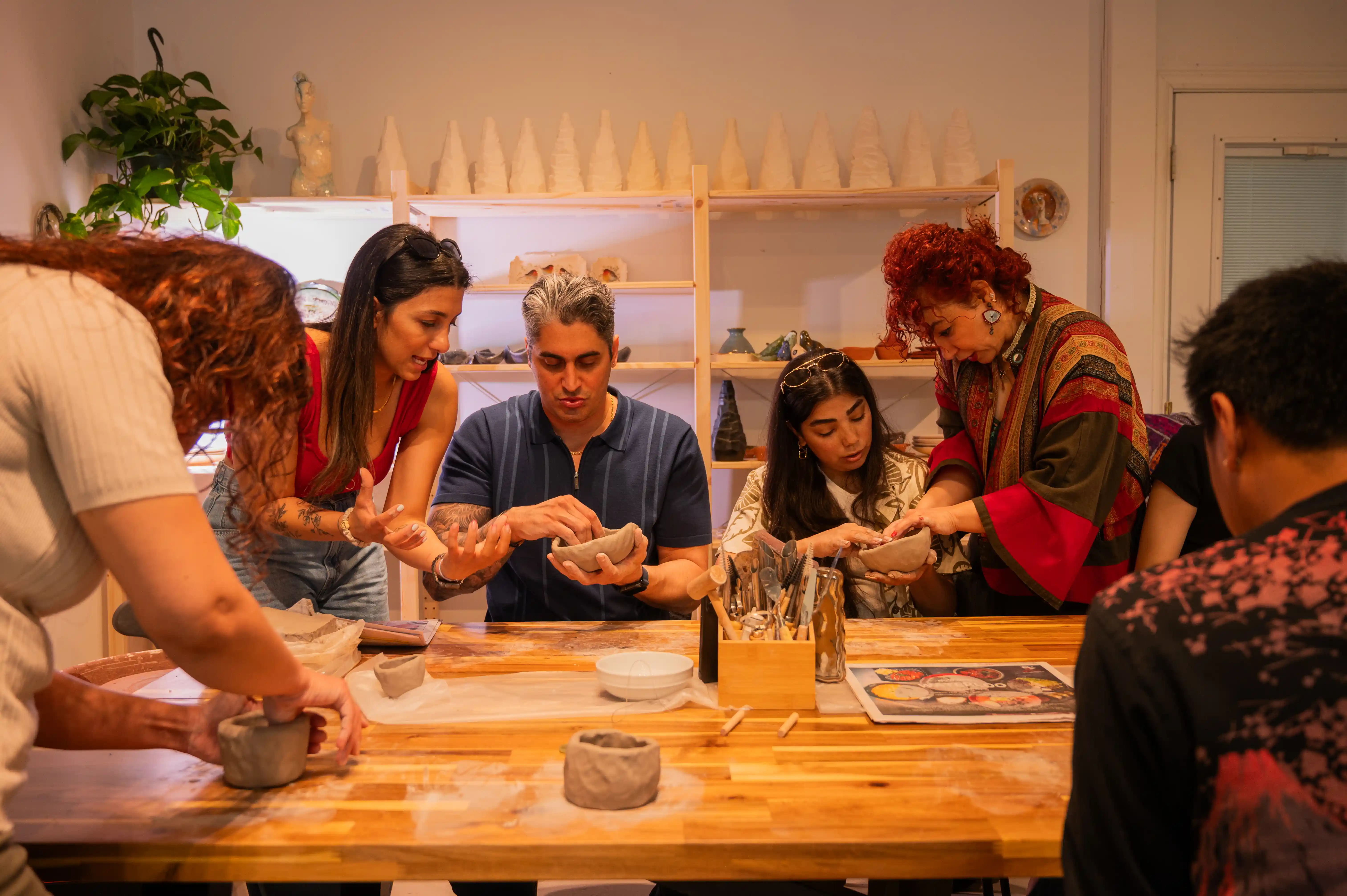 Student shaping clay