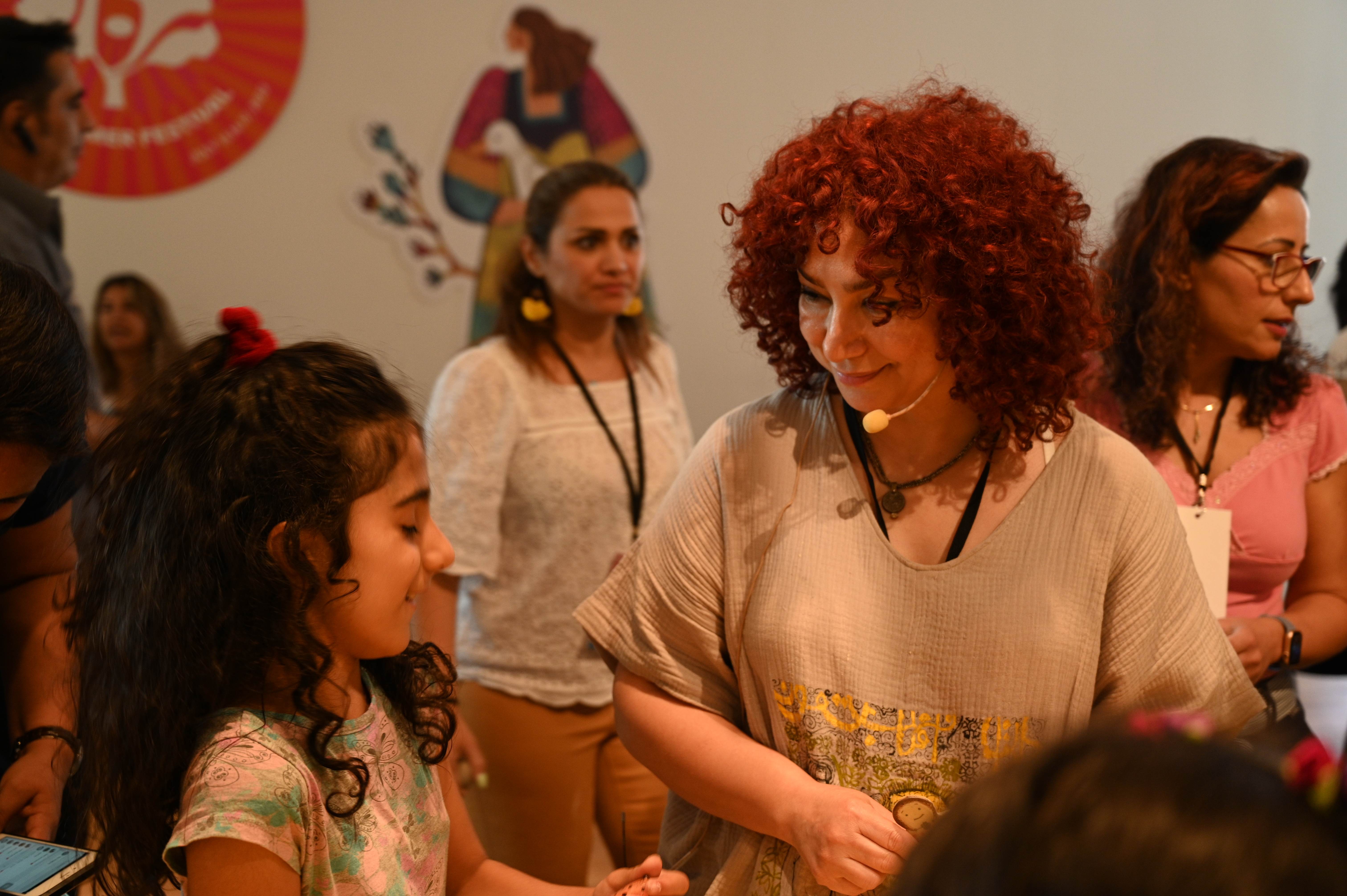 Marjan Hassaneini teaching a pottery workshop