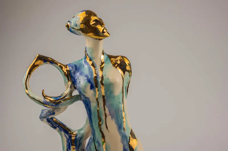 Sculpture by Marjan with blue and gold glazes